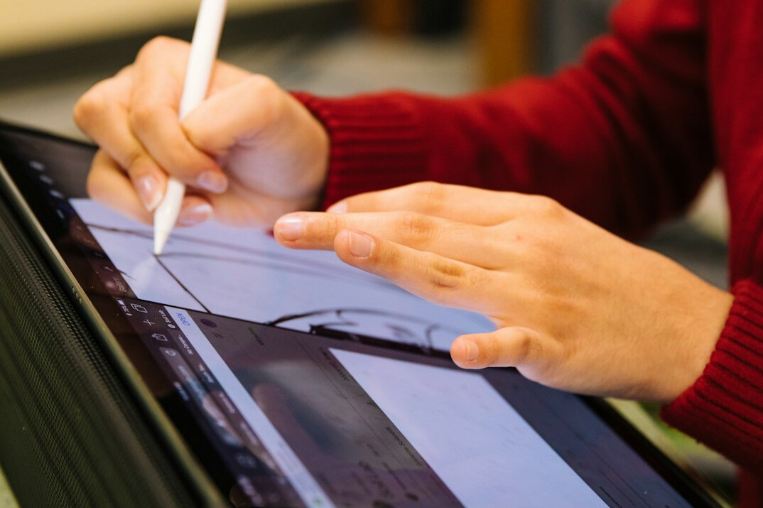 person editing document on computer