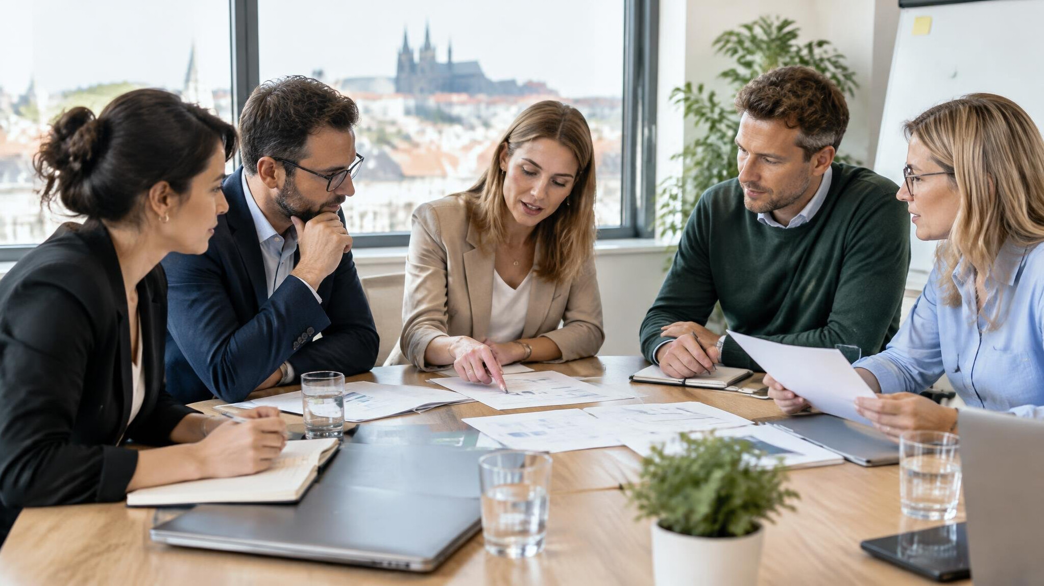 Professionals discussing business communication in a modern meeting room